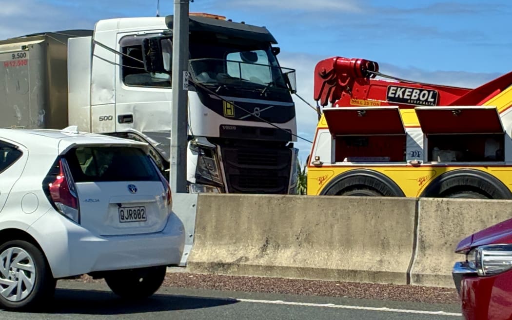 Truck v car crash on Auckland's northwestern motorway.