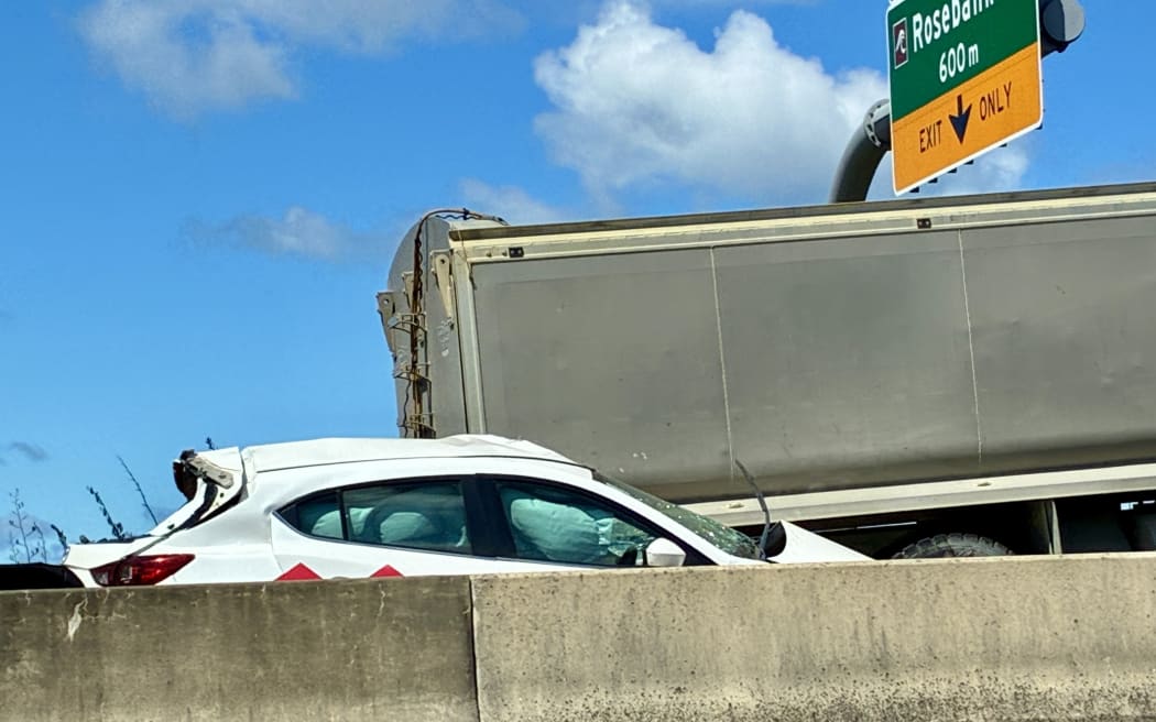 Truck v car crash on Auckland's northwestern motorway.
