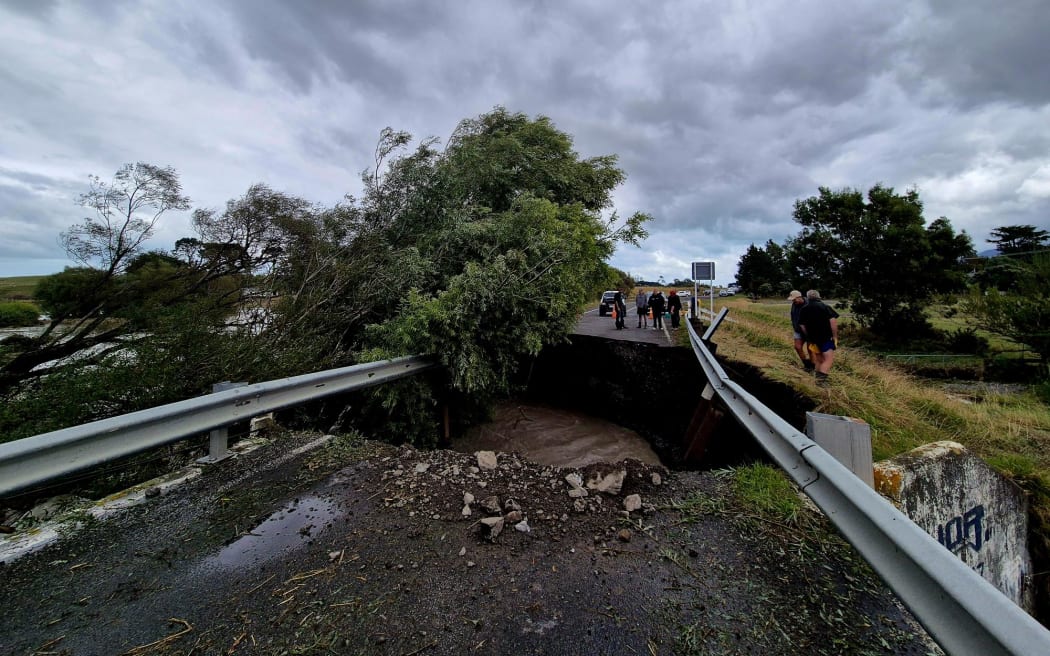 A washout on Lake Ferry Road has split families and left cut-off residents scrambling for supplies.