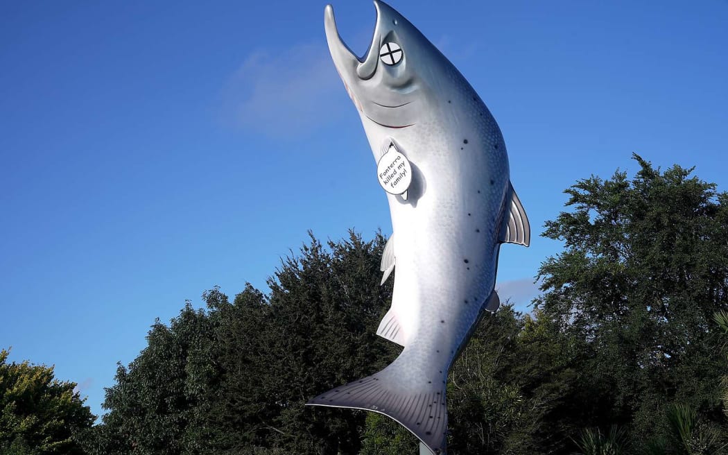 Greenpeace Aotearoa says its activists "altered" the Rakaia salmon statue, turning it into a cartoon dead fish in protest of the dairy industry's environmental destruction, but the council says it was vandalised.
