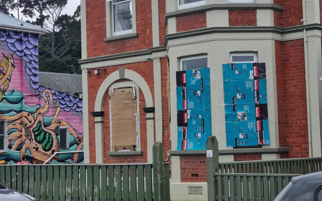 Some Castle Street flats had cardboard on their lower windows in what appears to be an attempt to protect them from damage