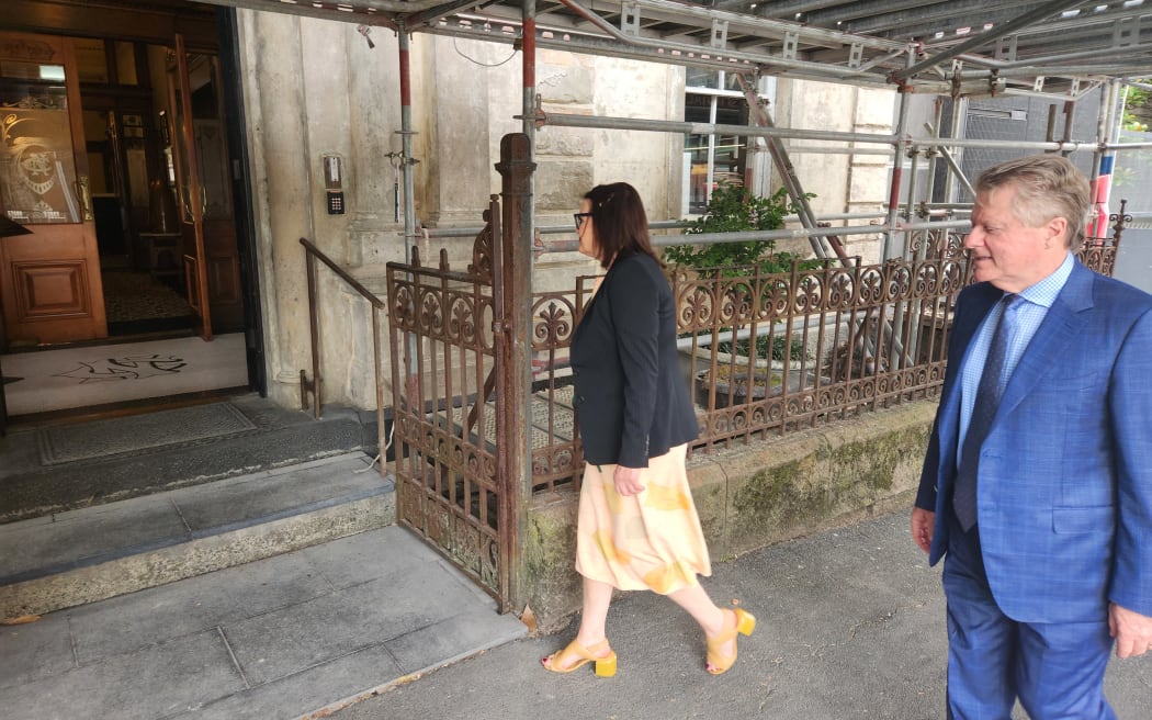 Judge Ema Aitken's lawyers enter the Northern Club for a site visit.