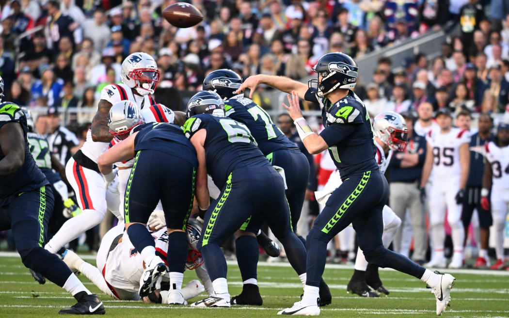 Seattle Seahawks’ quarterback #14 Sam Darnold throws the football during Super Bowl LX between the New England Patriots and the Seattle Seahawks at Levi's Stadium in Santa Clara, California on February 8, 2026. (Photo by JOSH EDELSON / AFP)