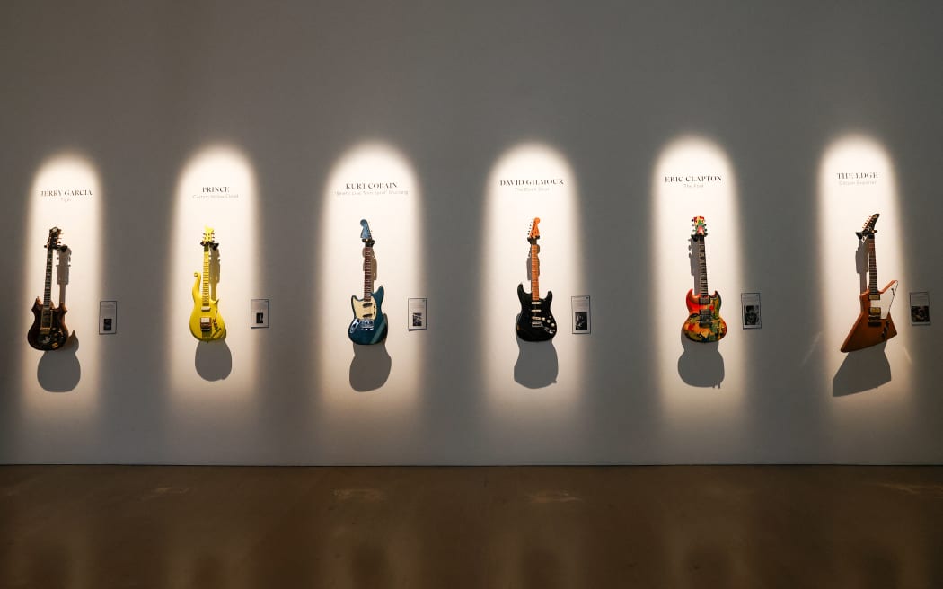 (L-R) Jerry Garcia’s guitar 'Tiger', Prince’s Andy Beech custom Yellow Cloud guitar, Kurt Cobain’s 1966 Fender Mustang guitar, David Gilmour’s 'Black Strat', Eric Clapton’s 'The Fool' Gibson SG and The Edge’s Gibson Explorer are displayed during a press preview of The Jim Irsay Collection at Christie’s Los Angeles in Beverly Hills.