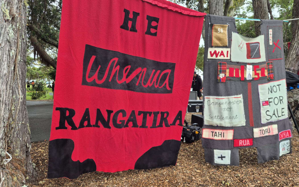 Banners put up by protestors around the Treaty Grounds.