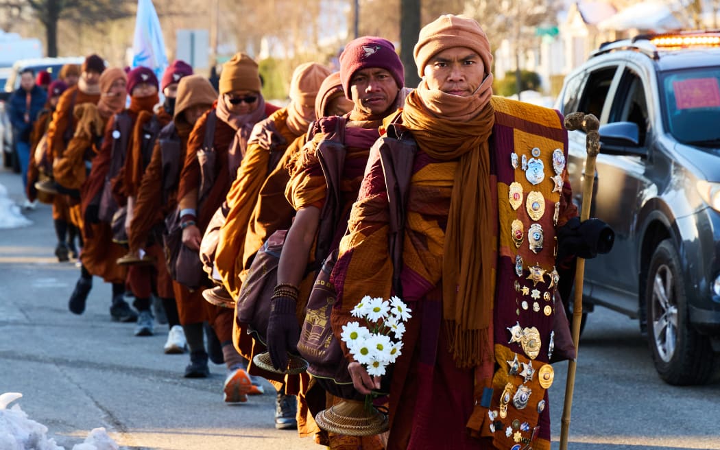Led by Bhikkhu Pannakara (R), Buddhist monks participate in a 
