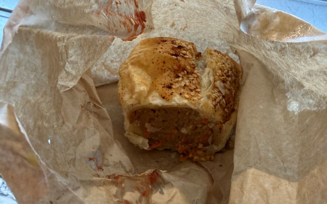 Bella the cat burglar, has been bringing home a surprising midnight feast for her owners - sausage rolls in brown paper bags.