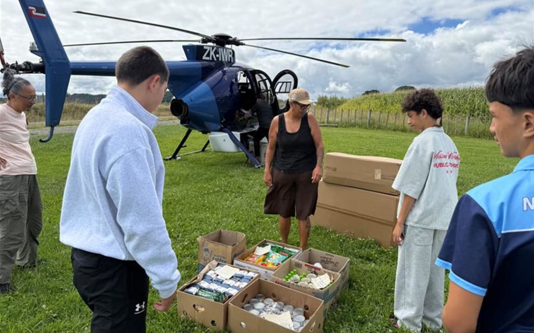 Manaaki Matakaoa team in Te Araroa unloading helicopter delivery. Left to right – Michaella Houkamau, Sheena Luke, Cecelia Kamizona, Ara Ariki Houkamau