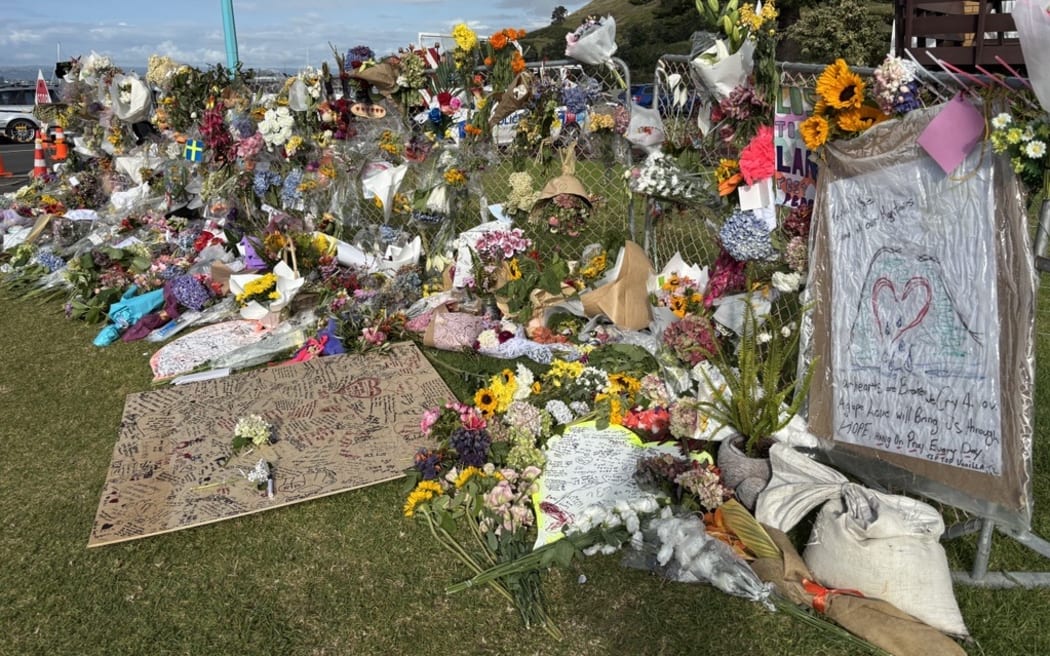 The cordon in Mount Maunganui following the deadly landslide is covered in tributes for the people who lost their lives.