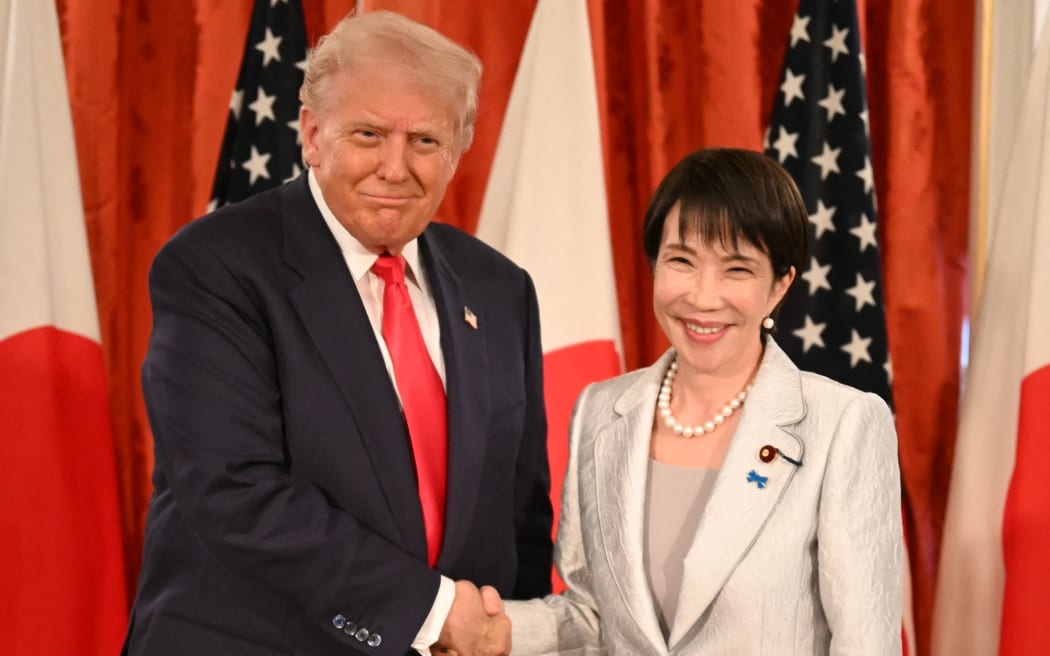 Japan's Prime Minister Sanae Takaichi (R) and US President Donald Trump attend a signing ceremony after a Japan-US Summit at the Akasaka State Guest House in Tokyo on October 28, 2025. (Photo by ANDREW CABALLERO-REYNOLDS / AFP)