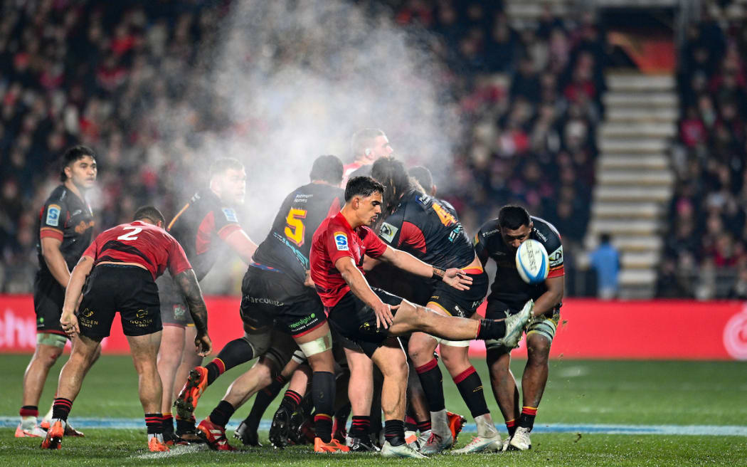 Noah Hotham of the Crusaders kicks during the Super Rugby Pacific Final.