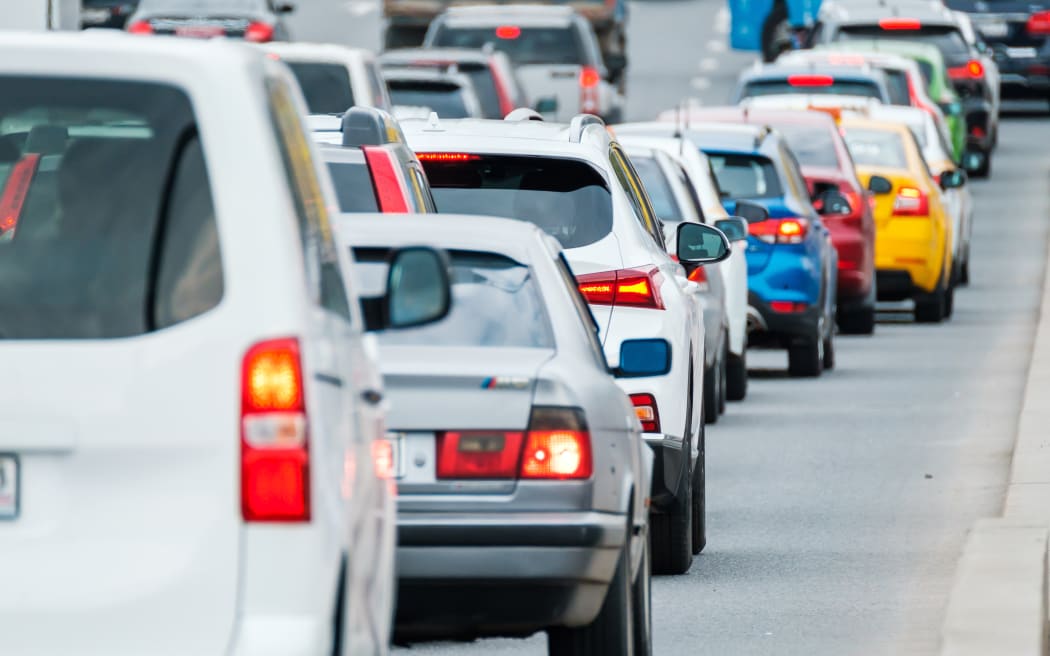 Traffic jam on multi-lane road in big city center downtown, day time