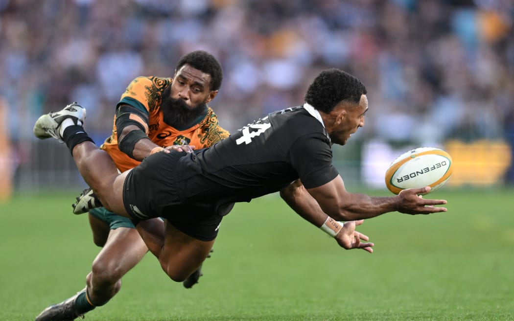 Sevu Reece of the All Blacks tackled by Marika Koroibete of the Wallabies during the All Blacks v Australia, Lipovitan-D Rugby Championship test match, Accor Stadium, Sydney, Australia, Saturday, 21 September 2024. (Photo by Steven Markham / action press)