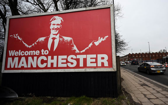 A billboard depicting INEOS Chairman and Manchester United shareholder Sir Jim Ratcliffe, near Old Trafford stadium, in Manchester.