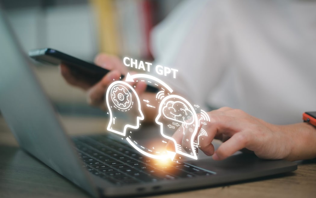 ChatGPT Chat with AI or Artificial Intelligence. woman chatting with a smart AI or artificial intelligence using an artificial intelligence chatbot developed by OpenAI.