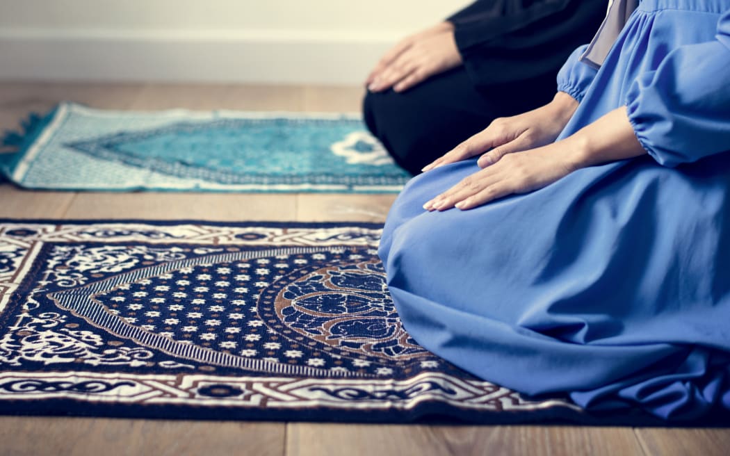 Muslim prayers in Tashahhud posture