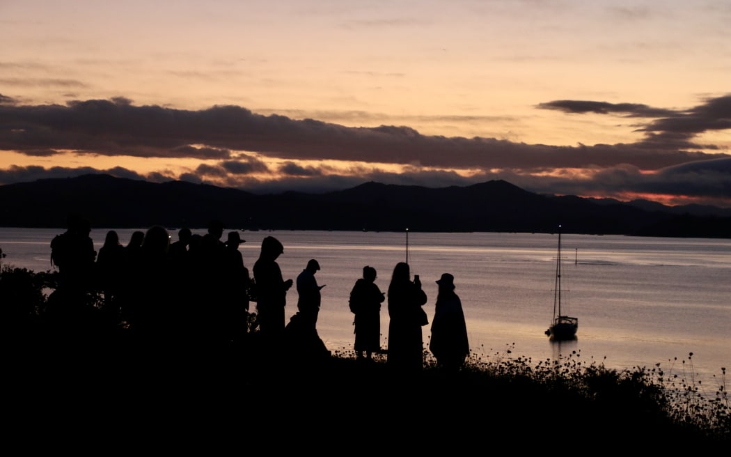 A sunrise dets during the dawn service on Waitangi Day. (2026)