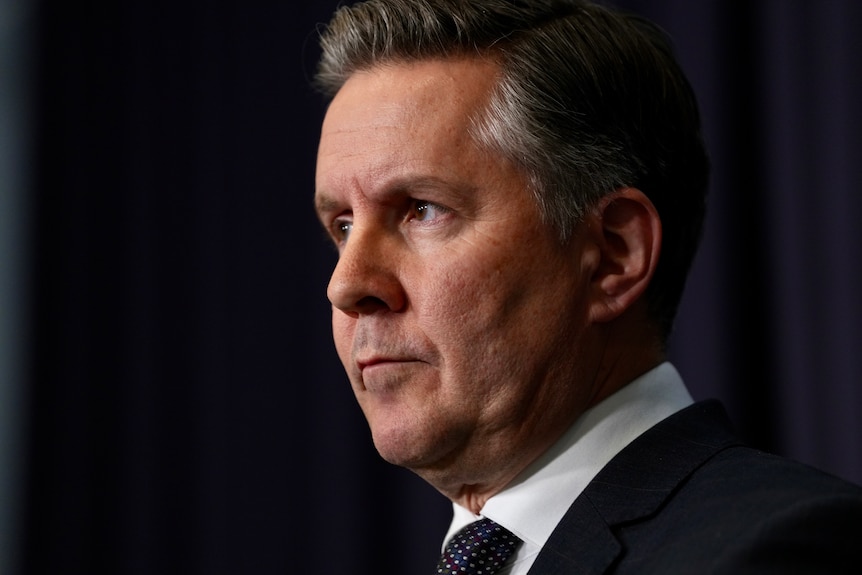 A close up side shot of Mark Butler looking serious.