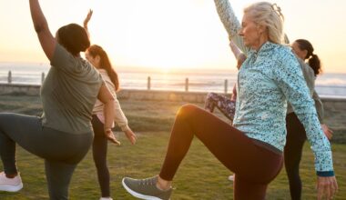 A group of mature exercisers balancing outside during a workout