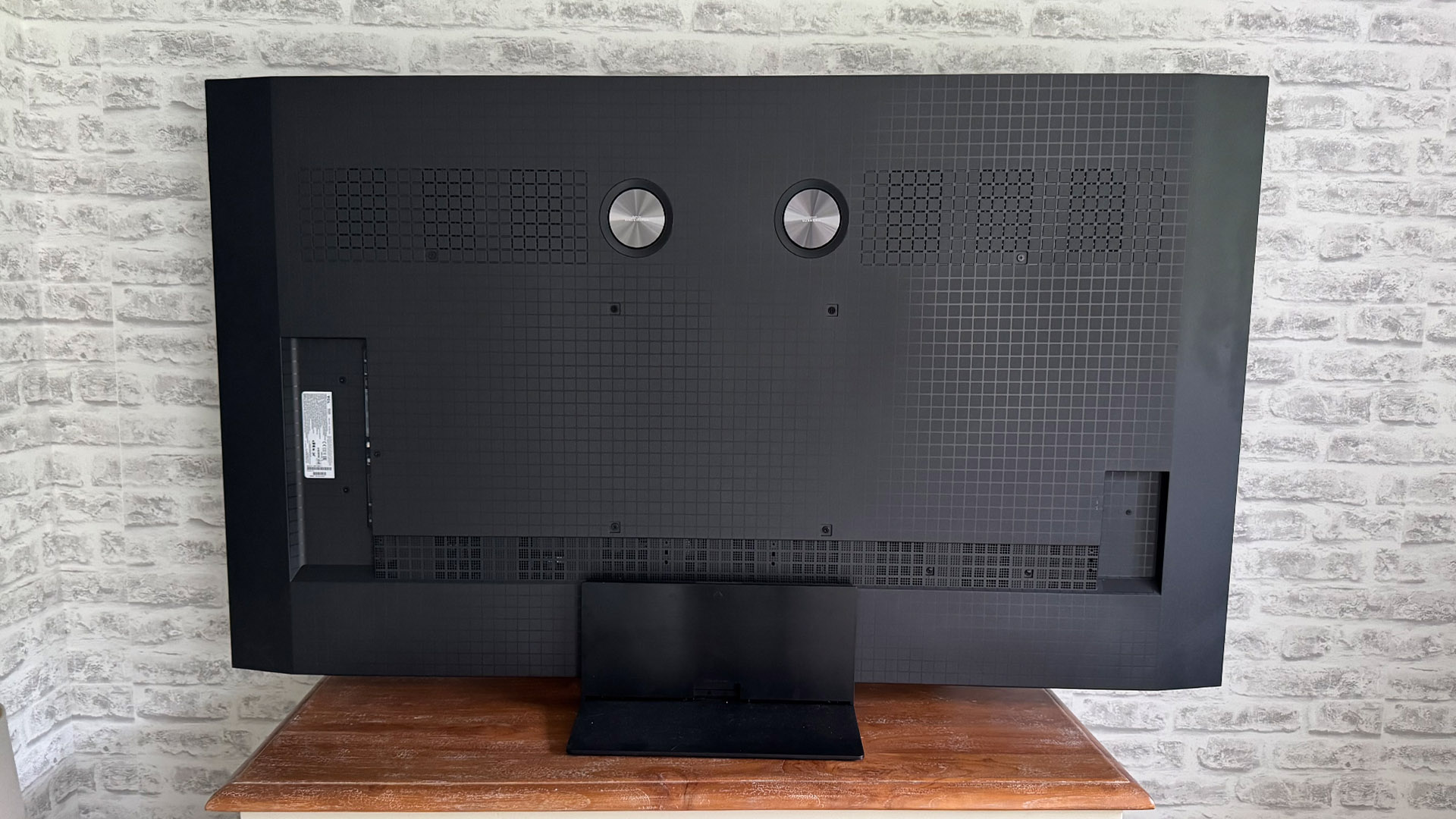 The 65-inch TCL C7K Mini LED TV photographed in a living room