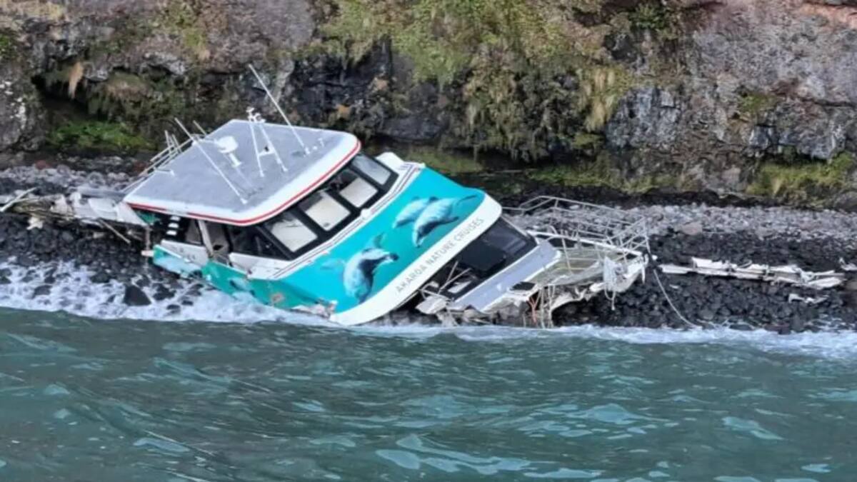 Swells dislodge wrecked catamaran from rocks in Akaroa Harbour