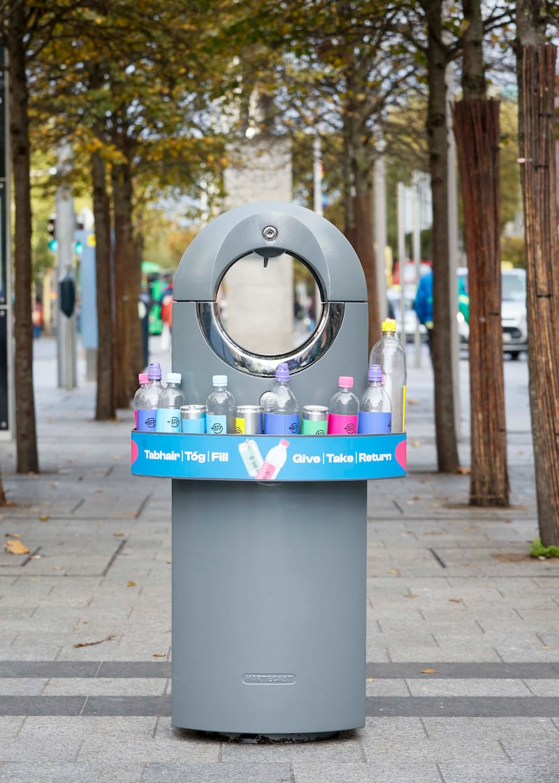 A bin with the ‘Give Take Return’ bottle and can bin surround. Photograph: Fennell Photography
