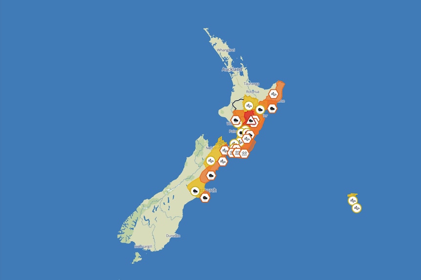 A map of new zealnd showing waether warnings in orange and red.