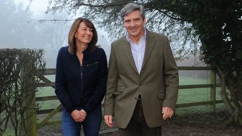Carole and Michael Middleton smile outside their home after Kate and William's engagement is announced
