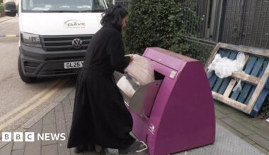 An older lady with long grey hair talks to another woman outside some flats in east London
