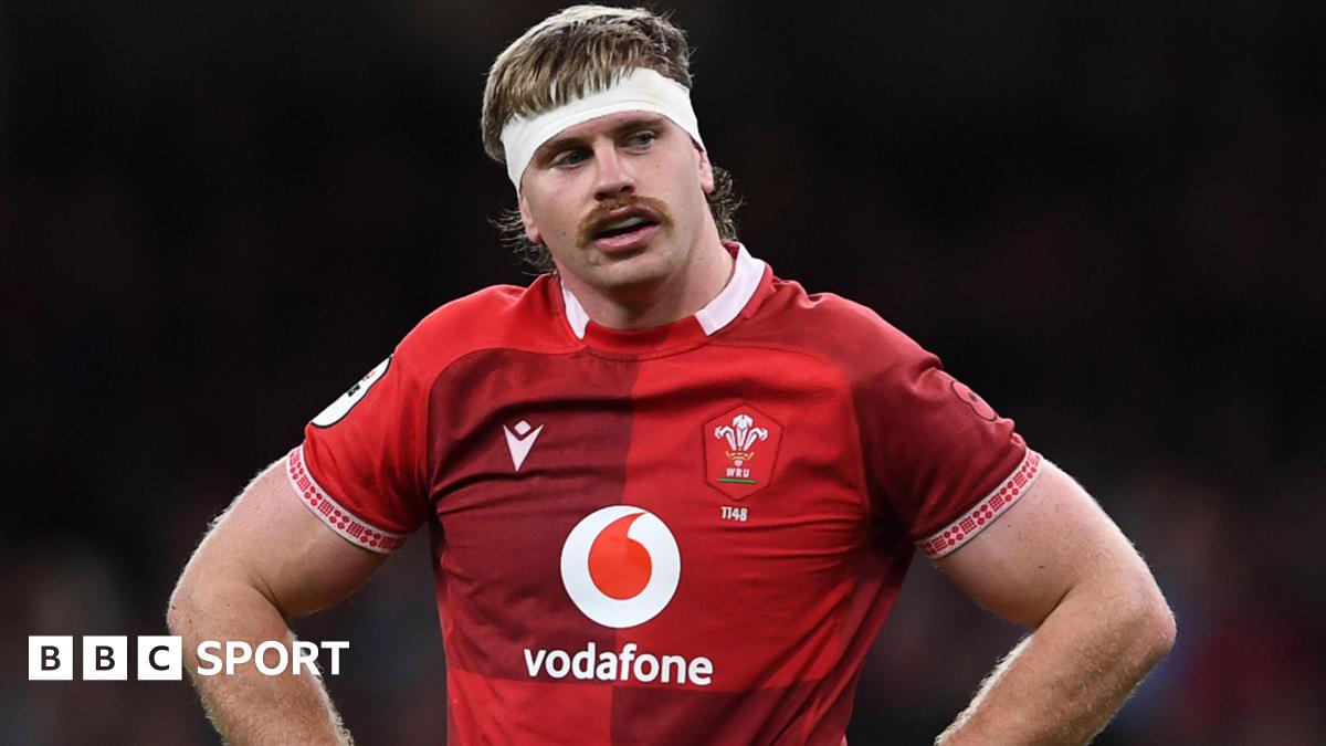 Aaron Wainwright for Wales with his hands on his hips