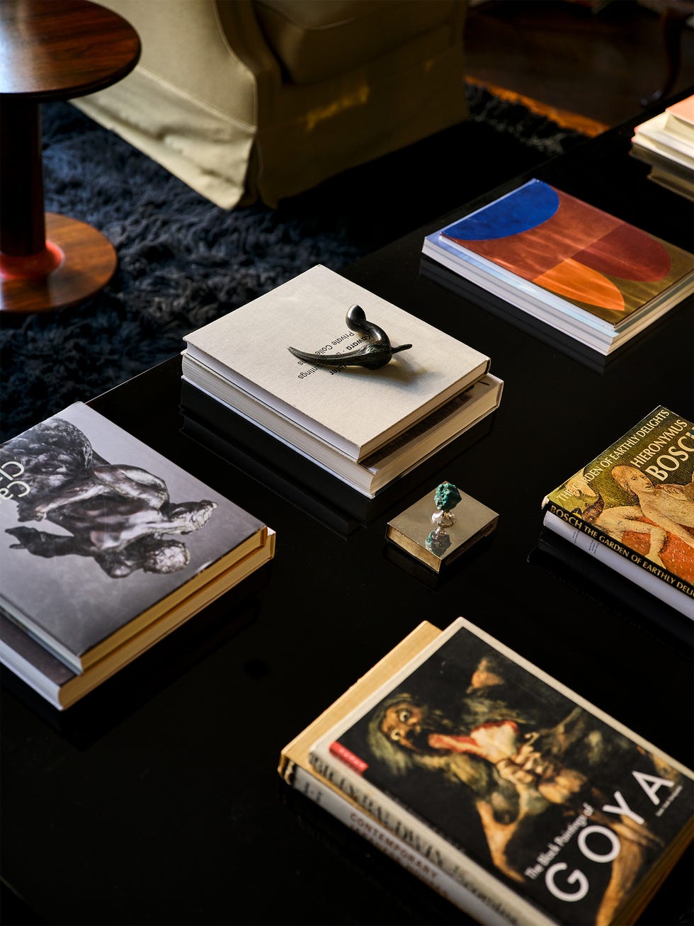 Coffee table with books and decorative items.