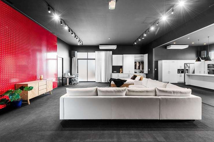 The black shed with a studio-style living area on Horsham Downs Road, Rototuna North, in Hamilton, sold to someone who plans to live in it as is. Photo / Supplied