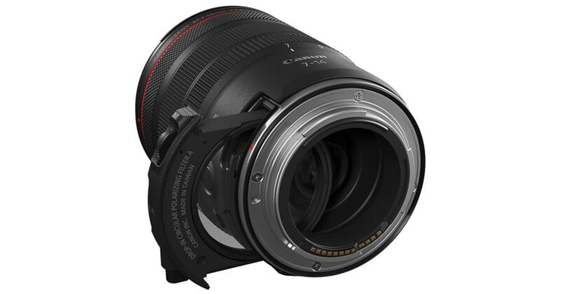 A close-up view of a Canon camera lens, showing the rear mount and electronic contacts, with an attached circular polarizing filter holder.