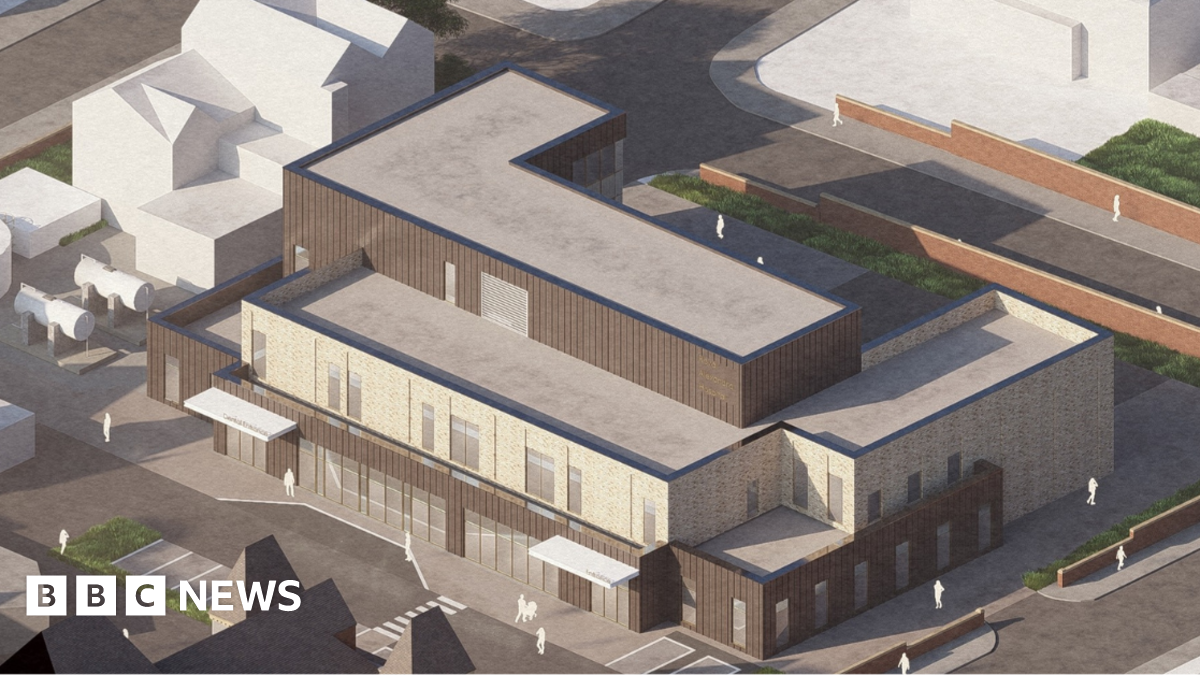 A computer-generated aerial view shows a modern, flat-roofed three-storey healthcare facility.