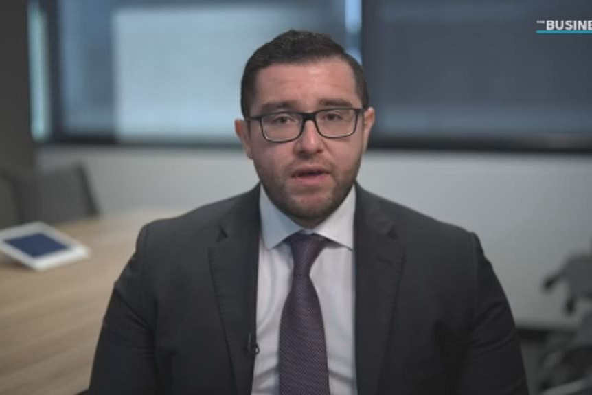 A man in a brown business suit.