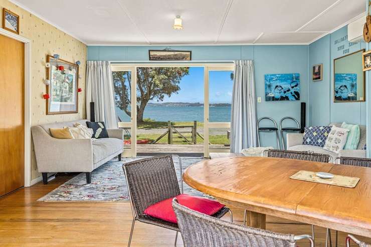 A classic beachfront bach at 1 Campbell Road, in Campbells Beach, on the Tawharanui Peninsula has only changed hands twice in 60 years. Photo / Supplied