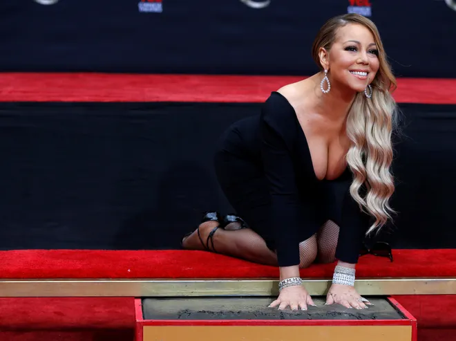 Singer Mariah Carey places her hands in cement in the forecourt of the TCL Chinese theatre in Los Angeles, California, U.S., November 1, 2017.