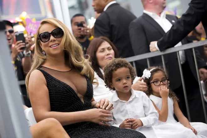 Recording artist Mariah Carey and her children Moroccan Scott and Monroe Cannon attend the ceremony for the unveiling of her star on the Hollywood Walk of Fame in Los Angeles, California August 5, 2015.