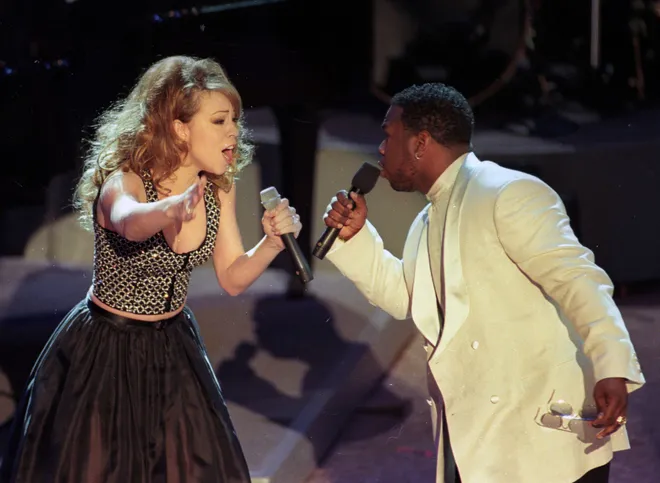Mariah Carey performs "One Sweet Day" with Wayna Morris of Boyz II Men at the 38th annual Grammy Awards on February 28, 1996 in Los Angeles.