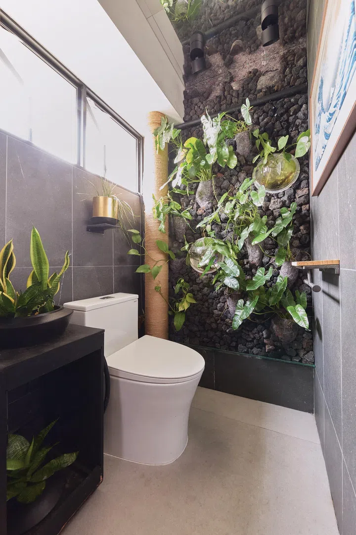 A vertical plant wall in the bathroom in architect interior designer Winston Lim (of Winstudio)’s 3-room HDB in Pasir Ris.
