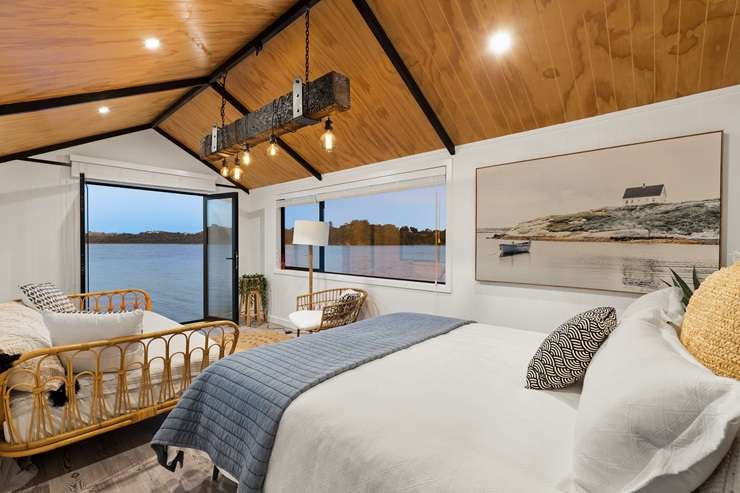 Kelly and Nathan Coe have listed their five-bedroom holiday escape at Te Kapa Inlet, in Mahurangi East. Photo / Supplied