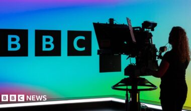 A BBC camera operator in a studio