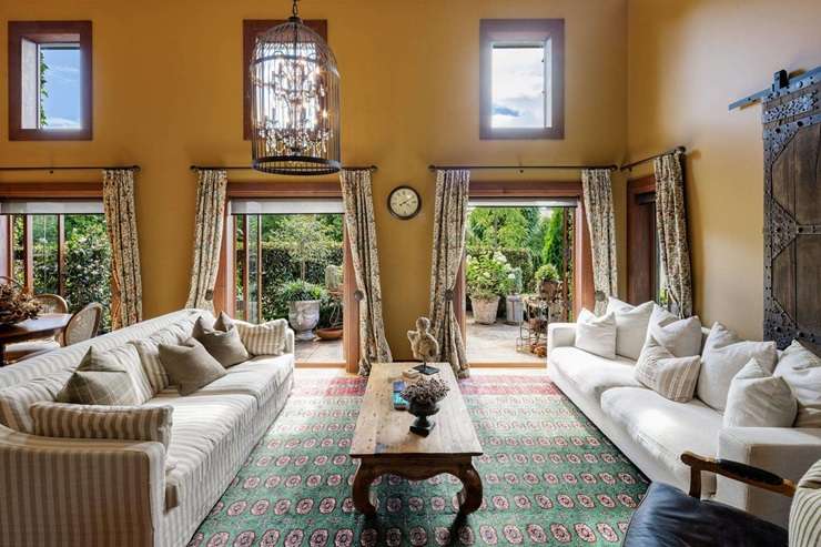 Corina Montgomery and David Lawrence are selling their French chateau, which looks centuries old but was completed in 2018. Photo / Supplied