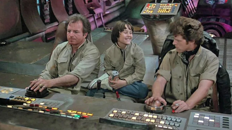 Peter sitting between two crew members in "Space Raiders"