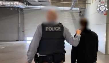 New Zealand man arrested at Perth Airport after violent extremist material found on phone