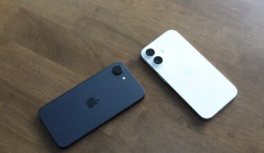 Two Apple iPhone 16e units splayed on table