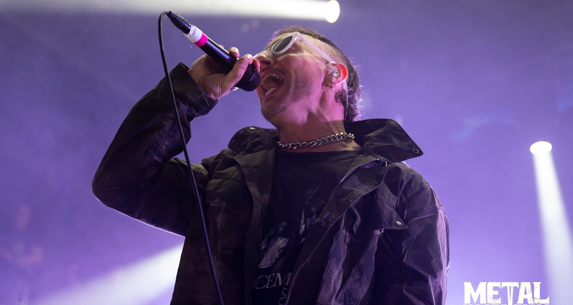Greg Puciato, vocalist of Better Lovers, performing live on stage with intense energy and dynamic lighting