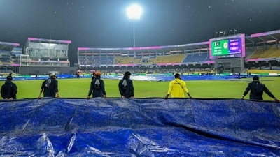 Ground staff cover the field as rain delayed the start of the T20 World Cup Super Eight match between Pakistan and New Zealand in Colombo (AFP)