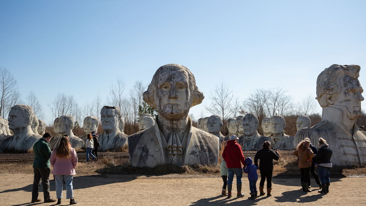 Hundreds of people celebrate the crumbling beauty of concrete sculptures of most former US leaders