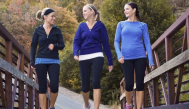 three women walking for fitness outside